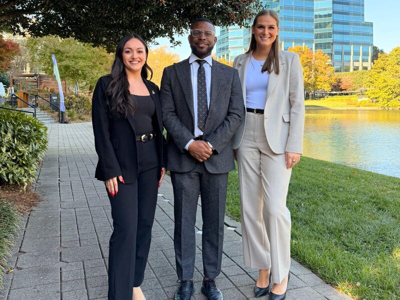 Three members of the TriMkt leadership team outside the Raleigh office